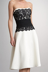 You can&rsquo;t go wrong with a timeless palate and silhouette! This satin dress has a lace bodice and sash for a feminine flourish. Imported.