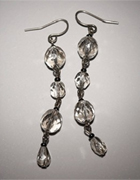These hematite linear earrings have a platinum tone for a chic glow. Wire. 